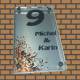 Glazen naambord met bloemen print op rvs look achterplaat